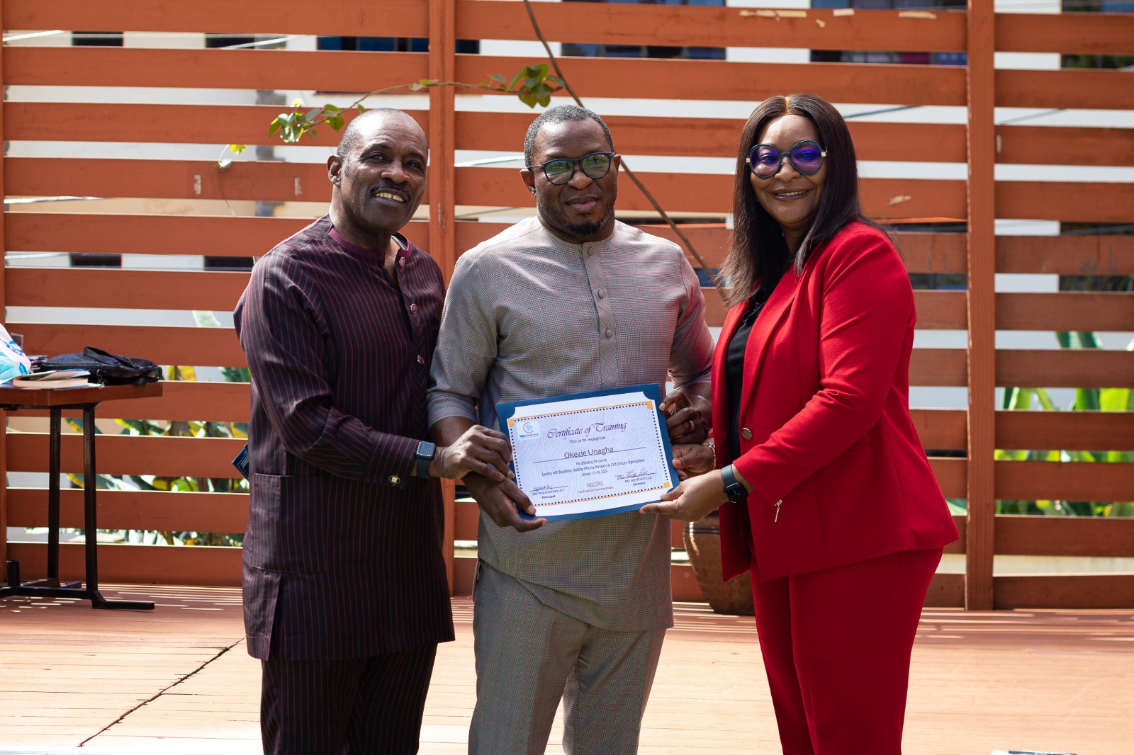 Participant receiving a certificate during the 2024 NCDMB program in Kigali